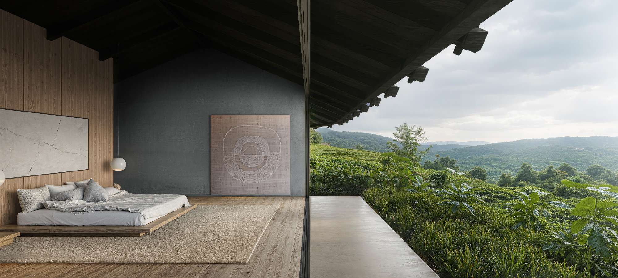 Bedroom opening directly onto the natural landscape through large sliding glass panels and covered terraces.