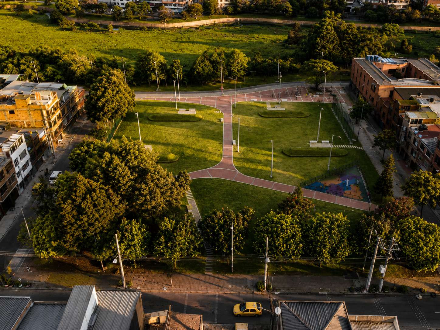 Aerial photograph of a neighborhood park using permeable paving, landscape design and ecological urbanism principles.